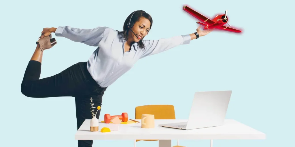 A woman in a white shirt and black pants doing a yoga pose with a laptop